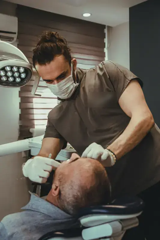 A dentist treating a patient