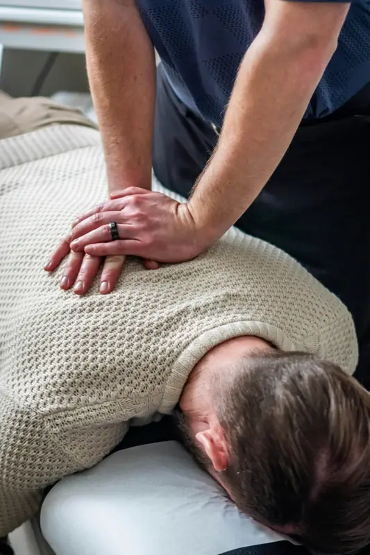 A physiotherapist treating a patient's back