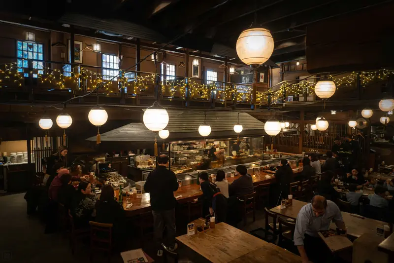 A busy restaurant dining room in the evening