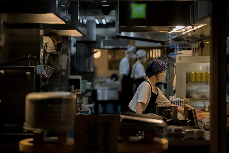 Cooks at work in a restaurant kitchen